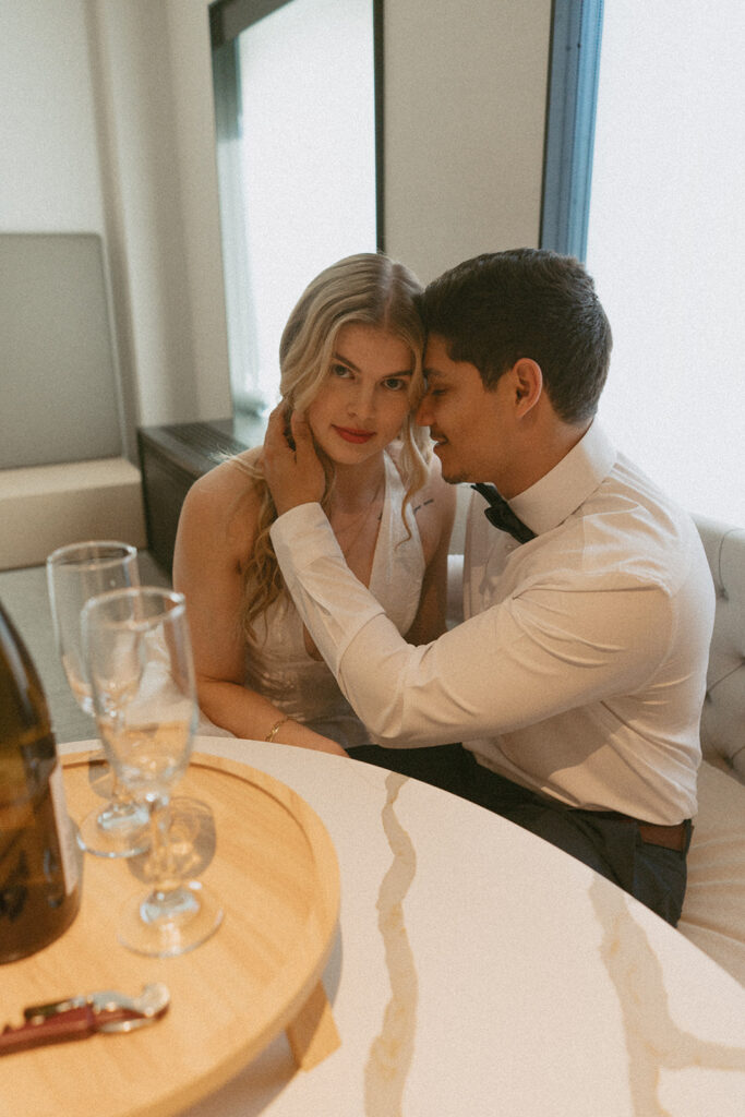 wife and husband in their hotel room at The Satire in Old Town Alexandria, Virginia in their wedding attire