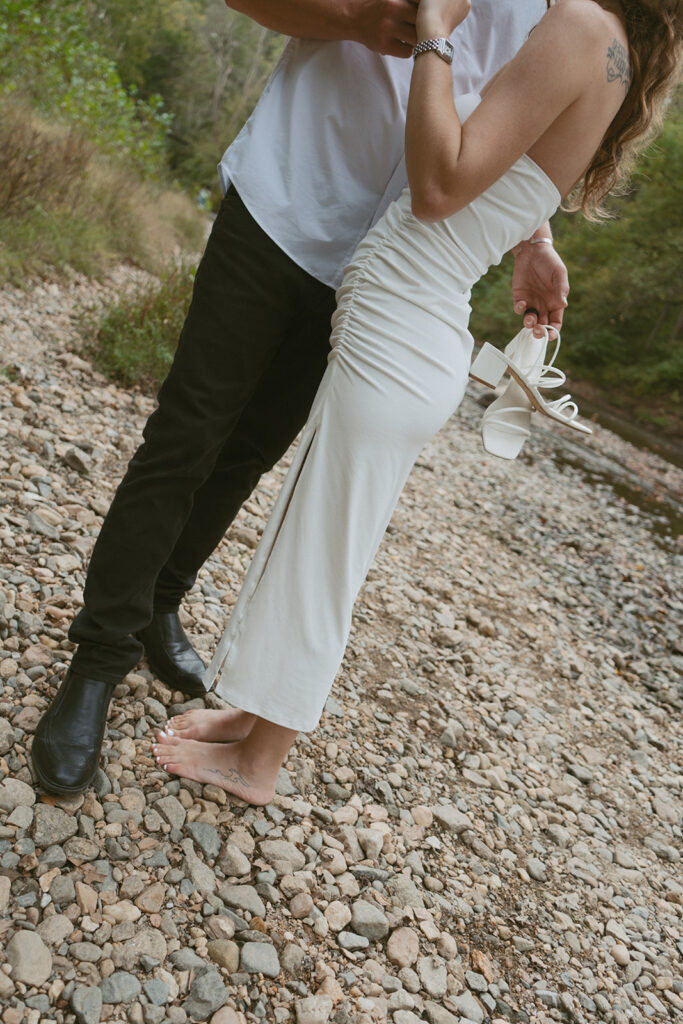 Engaged couple hugging in a Maryland State Park