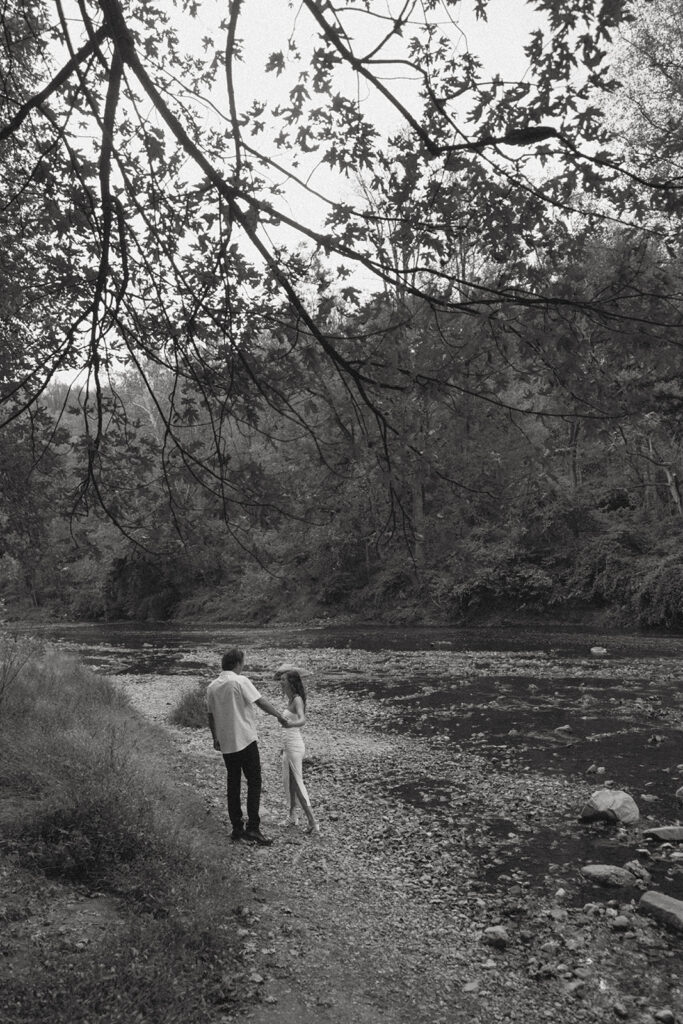 Engaged couple enjoying each other's company by a river in Maryland