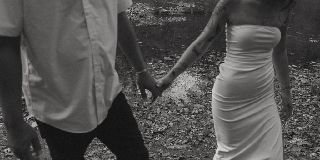 Engaged couple holding hands